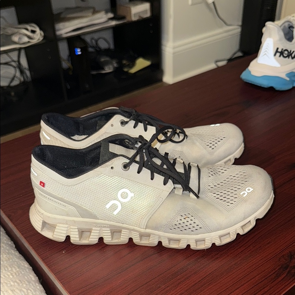 On Running White and Black Athletic Shoes with CloudTec Cushioning